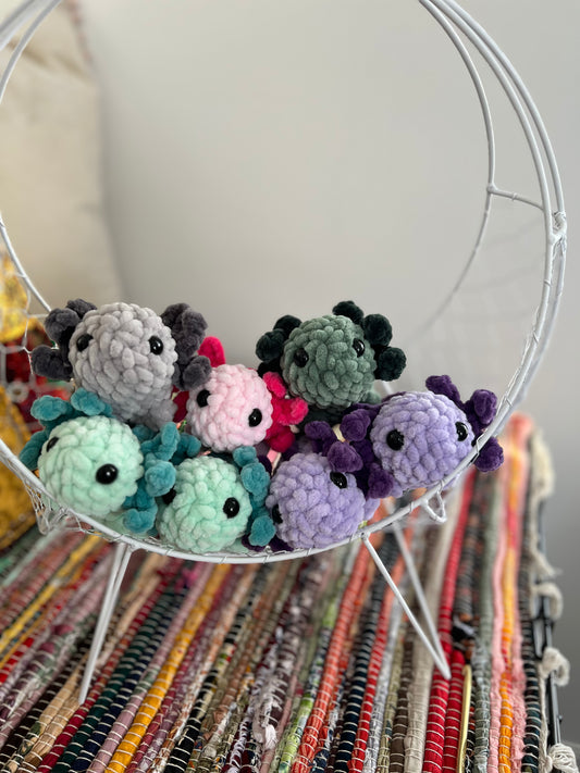 Baby axolotl plushies